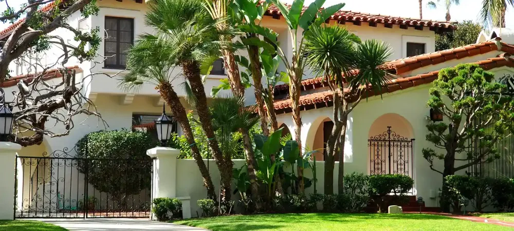 white house with brown roof
