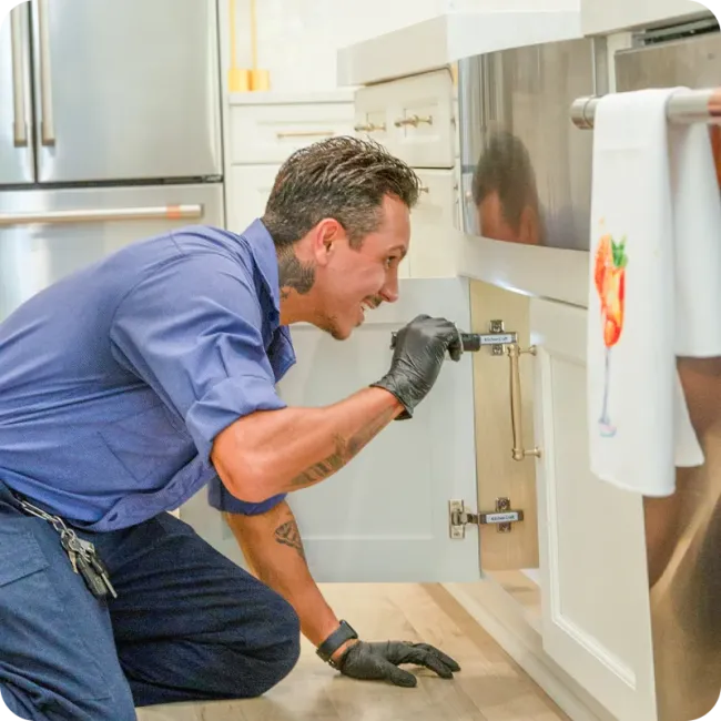 Hulett technician inspecting kitchen